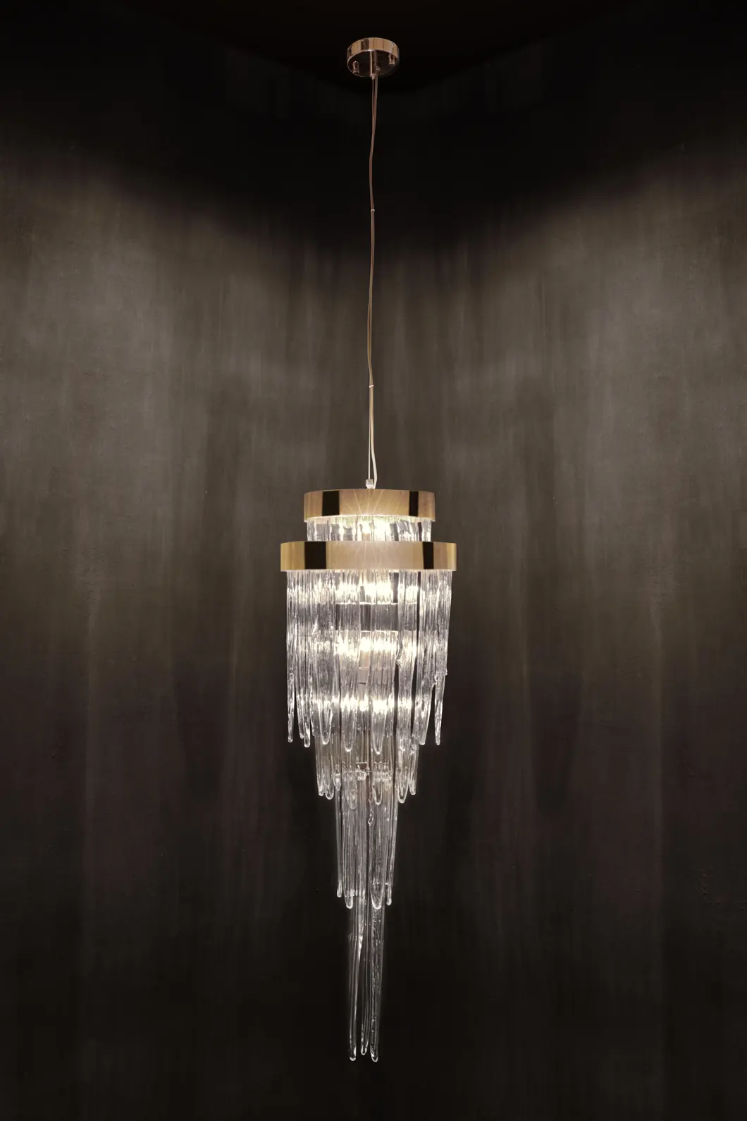 Babel pendant light hanging above dining table in contemporary living space