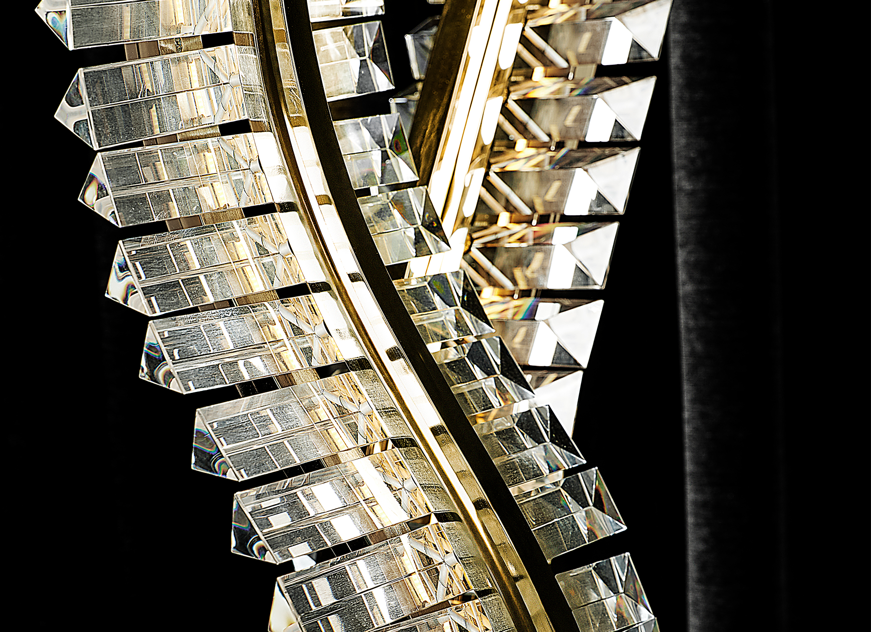 Liwave chandelier illuminated, showcasing warm LED lighting and reflective crystals