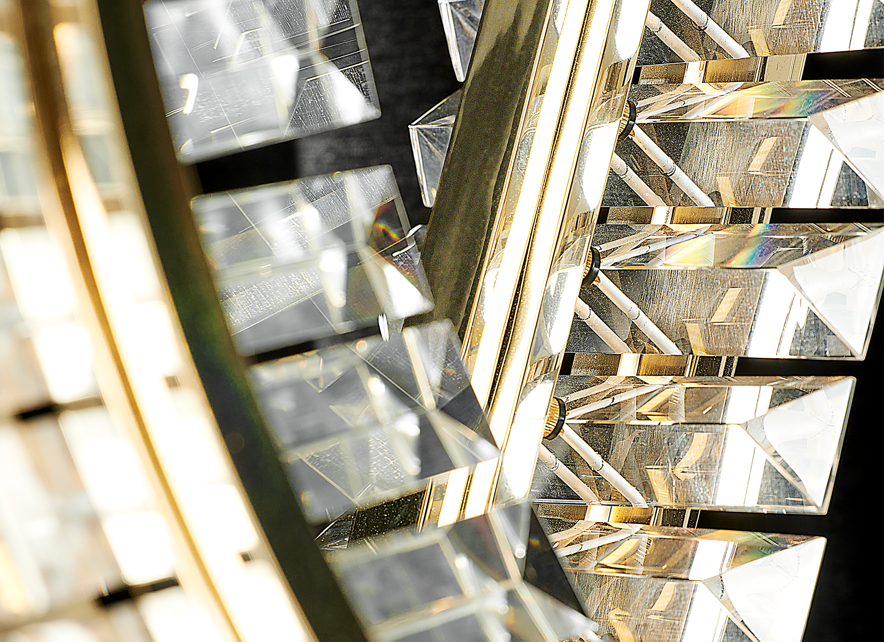 Liwave chandelier illuminated, showcasing warm LED lighting and reflective crystals